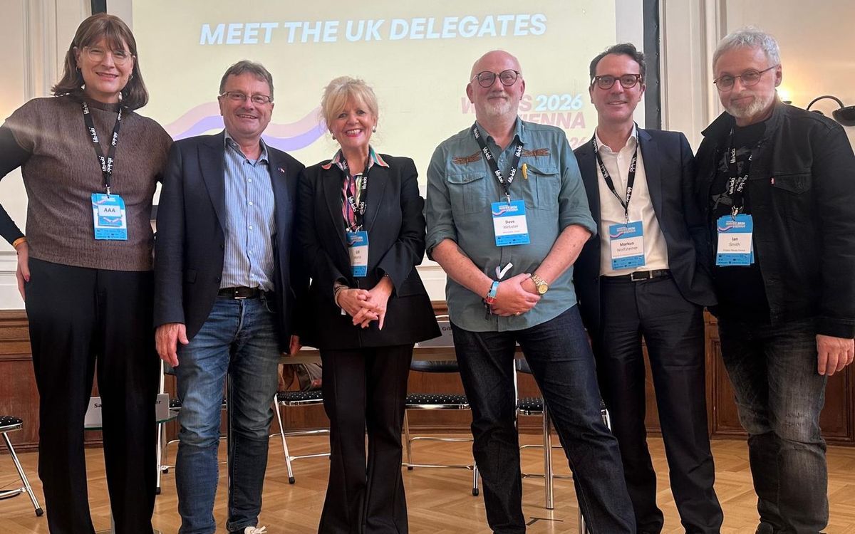UK delegates at Waves Vienna 2026 in front of a screen reading Meet the UK Delegates